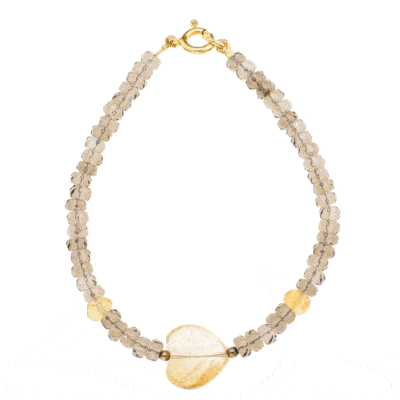 Handmade bracelet with natural, faceted, rondel shaped smoky quartz and citrine quartz gemstones. The bracelet has one citrine quartz gemstone heart in the center and gold plated sterling silver clasp.