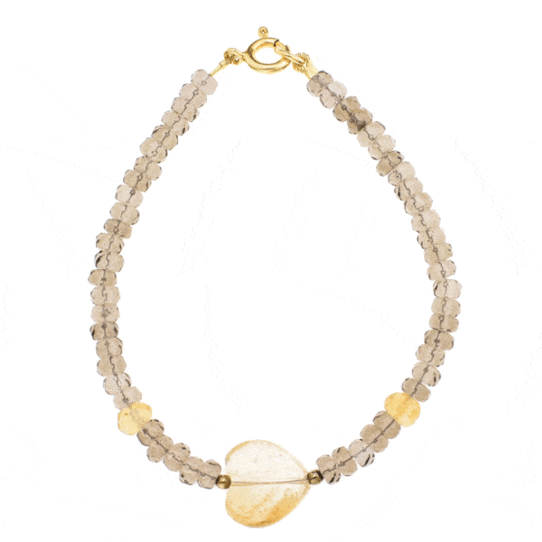 Handmade bracelet with natural, faceted, rondel shaped smoky quartz and citrine quartz gemstones. The bracelet has one citrine quartz gemstone heart in the center and gold plated sterling silver clasp.