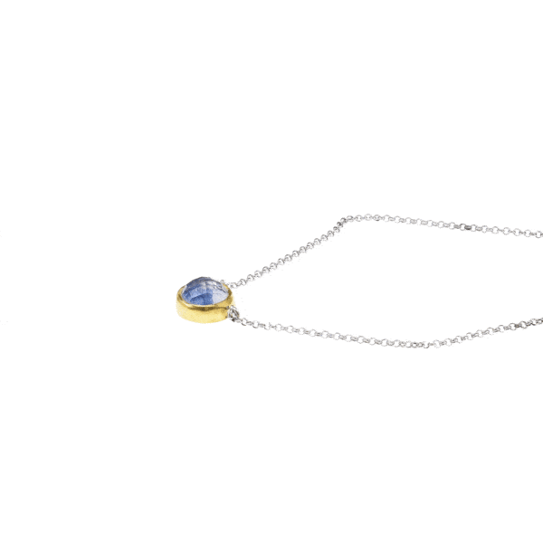 Handmade sterling silver pendant with doublet made of Crystal Quartz and Kyanite, in a round shape. The doublet consists of two layers of stones. The upper stone is Crystal Quartz and the stone at the bottom is Kyanite. The pendant has gold plated silver bezel and embedded sterling silver chain. Buy online shop.