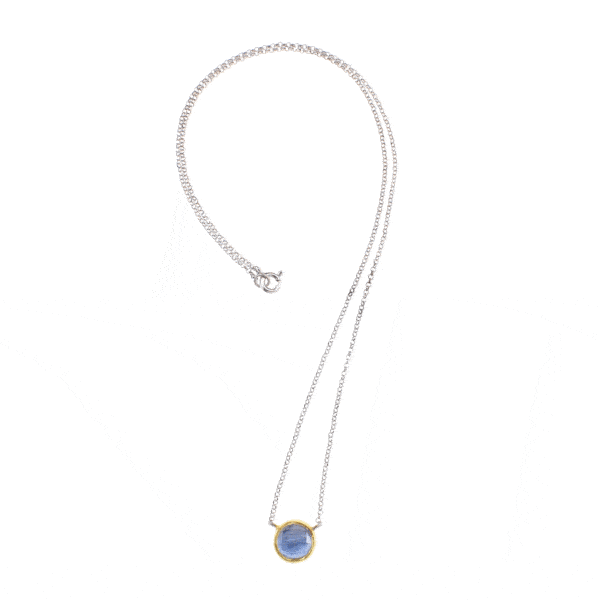 Handmade sterling silver pendant with doublet made of Crystal Quartz and Kyanite, in a round shape. The doublet consists of two layers of stones. The upper stone is Crystal Quartz and the stone at the bottom is Kyanite. The pendant has gold plated silver bezel and embedded sterling silver chain. Buy online shop.