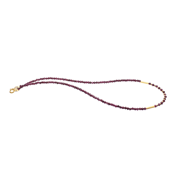 Handmade necklace with natural, faceted, rhombic shaped garnet and spherical shaped pyrite gemstones. The necklace has a clasp and decorative elements made of gold plated sterling silver.