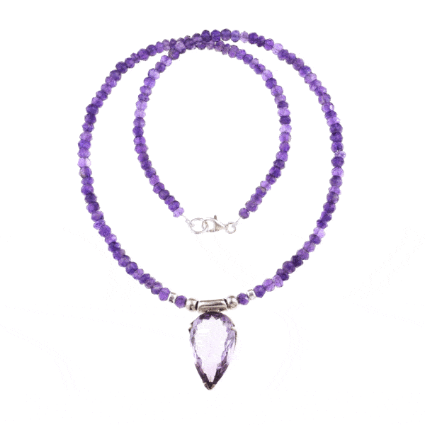 Handmade necklace with natural Amethyst gemstones in a rondel shape and one central Amethyst piece in the shape of tear-drop. The necklace has decorative elements and clasp made of sterling silver. Buy online shop.