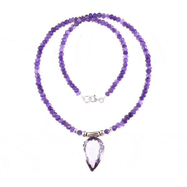 Handmade necklace with natural Amethyst gemstones in a rondel shape and one central Amethyst piece in the shape of tear-drop. The necklace has decorative elements and clasp made of sterling silver. Buy online shop.