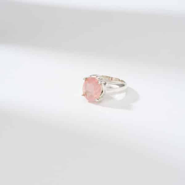 Handmade ring made of sterling silver and natural rose quartz gemstone in an oval shape. Buy online shop.