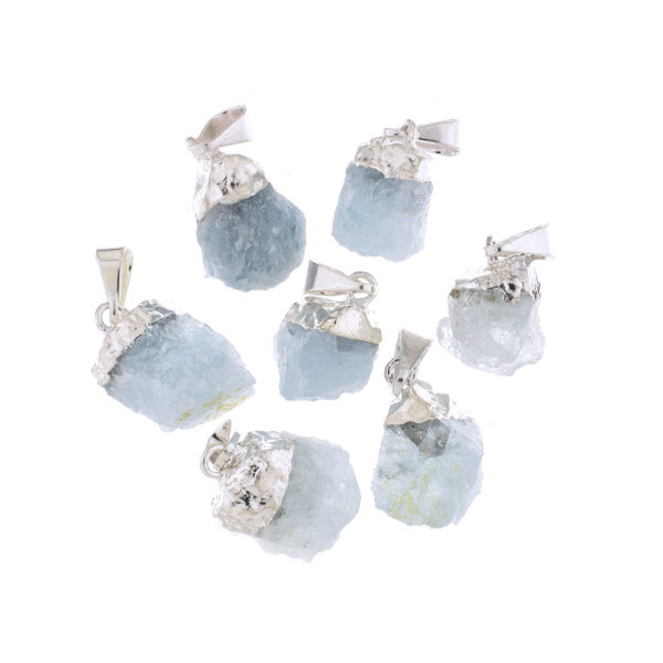 Pendants made of silver plated hypoallergenic metal and natural aquamarine crystals in a rough form. Buy online shop.