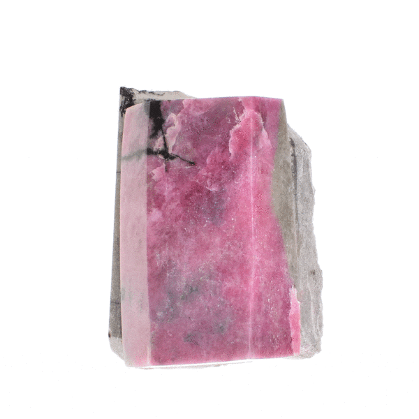 Sculptured and polished piece of natural rhodonite gemstone on its rock with cutted base and the size of 9cm. Buy online shop.