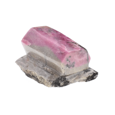 Sculptured and polished piece of natural rhodonite gemstone on its rock with cutted base and the size of 9cm. Buy online shop.