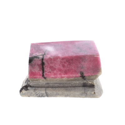 Sculptured and polished piece of natural rhodonite gemstone on its rock with cutted base and the size of 9cm. Buy online shop.