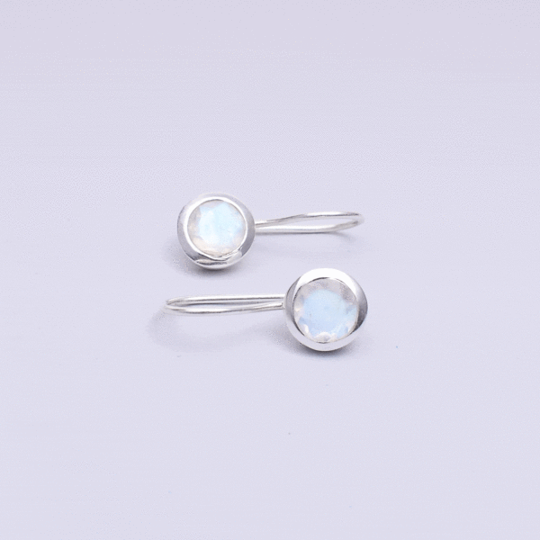 Handmade earrings made of sterling silver and natural, faceted white labradorite gemstone in a round shape. Buy online shop.