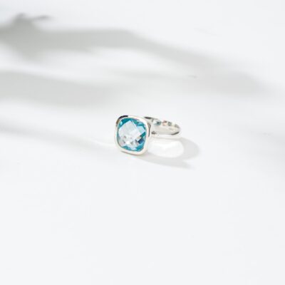 Handmade ring made of sterling silver and natural blue topaz gemstone in a square shape. Buy online shop.