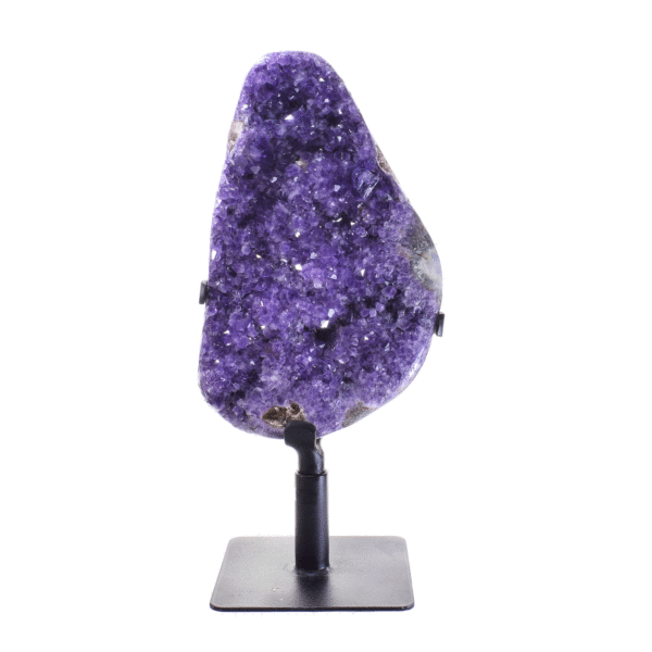 Raw piece of natural amethyst gemstone with polished outline, placed on a rotating metallic base. The half-upper part of the base is rotating, while the rest part remains stable.The amethyst on a base has a height of 41cm. Buy online shop.