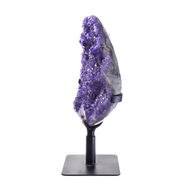Raw piece of natural amethyst gemstone with polished outline, placed on a rotating metallic base. The half-upper part of the base is rotating, while the rest part remains stable.The amethyst on a base has a height of 41cm. Buy online shop.