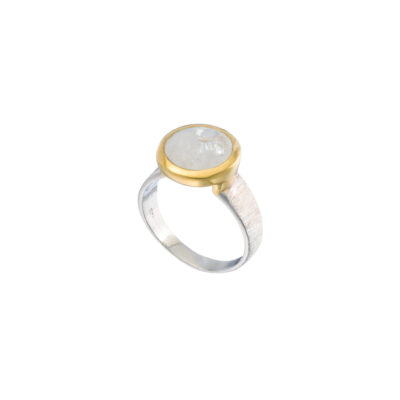 Handmade ring made of sterling silver and natural white labradorite gemstone in a round shape. The ring has textured band and gold plated bezel. Buy online shop.