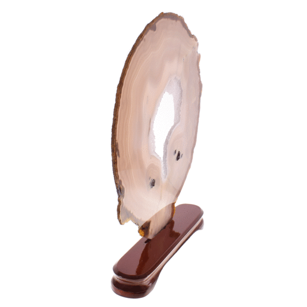 Slice of natural agate gemstone with crystal quartz, placed on a wooden base. The agate is polished on both sides and it has a height of 35cm. Buy online shop.