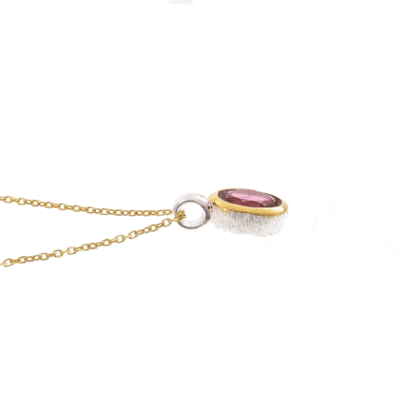 Handmade pendant made of sterling silver with gold plated bezel and natural pink tourmaline gemstone, in an oval shape. The pendant is threaded on a gold plated sterling silver chain with adjustable length. Buy online shop.