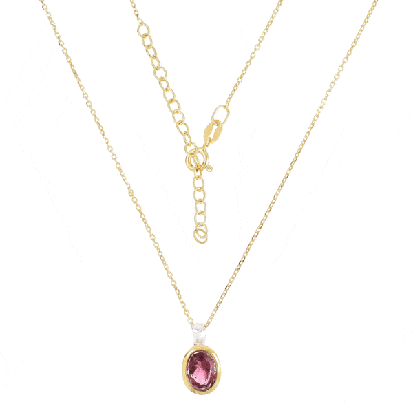 Handmade pendant made of sterling silver with gold plated bezel and natural pink tourmaline gemstone, in an oval shape. The pendant is threaded on a gold plated sterling silver chain with adjustable length. Buy online shop.