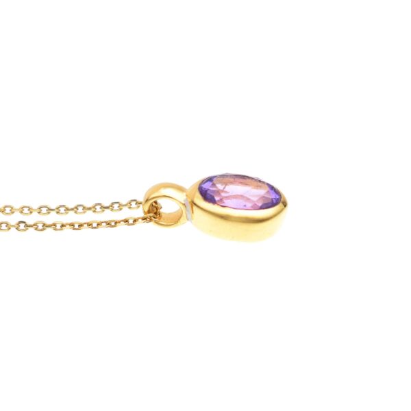 Handmade pendant made of gold plated sterling silver and natural, faceted amethyst gemstone, in an oval shape. The pendant is threaded on a gold plated sterling silver chain with adjustable length. Buy online shop.