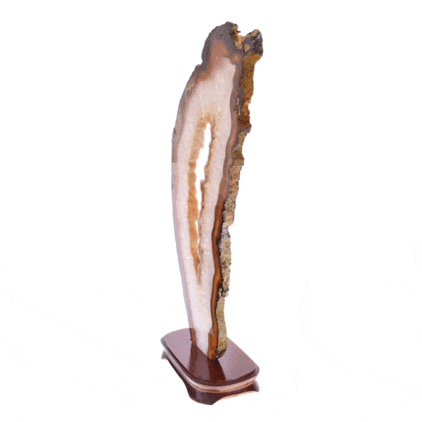 Polished slice of natural agate gemstone with crystal quartz, placed on a wooden base. The product has a height of 50cm. Buy  online shop.