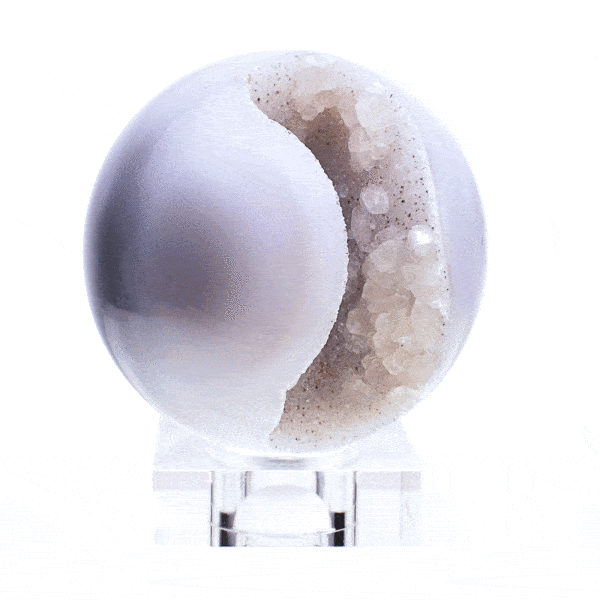 Sphere mafe of natural agate geode gemstone with crystal quartz of different size. The sphere has a diameter of 7.5cm. Buy online shop.