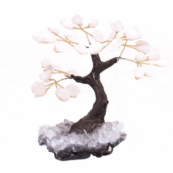 Handmade tree with polished leaves made of natural rose quartz gemstones and raw amethyst gemstone base. The tree has a height of 10cm. Buy online shop.