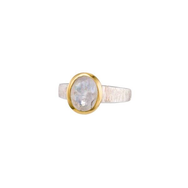 Handmade sterling silver ring with natural, oval-shaped, white labradorite gemstone. The ring has textured band and gold plated bezel. 