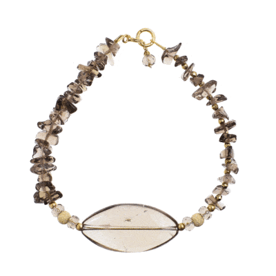 Handmade bracelet with natural smoky quartz and pyrite gemstones in an irregular, oval and spherical shape. The bracelet has a clasp and decorative elements made from gold plated sterling silver. Buy online shop.