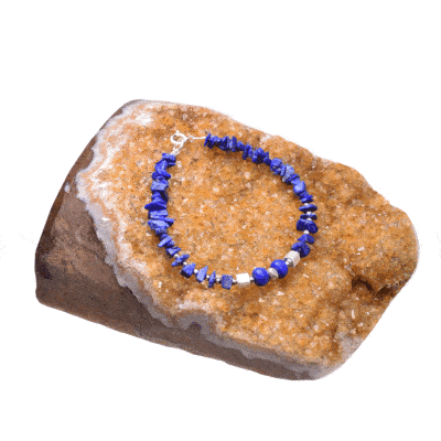 Handmade bracelet with small, polished pieces of natural lapis lazuli gemstone in an irregular and rondel shape and natural faceted hematite gemstones in a spherical shape. The bracelet has decorative elements and clasp made from sterling silver. Buy online shop.