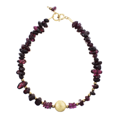 Handmade bracelet with small, polished pieces of natural garnet gemstone in an irregular shape and faceted pyrite gemstones in a spherical shape. The bracelet has decorative elements and clasp made from gold plated sterling silver. Buy online shop.