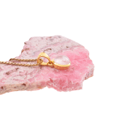Handmade oval shaped pendant made of gold plated sterling silver and natural rose quartz gemstone. The pendant is threaded on a gold plated sterling silver chain. Buy online shop.