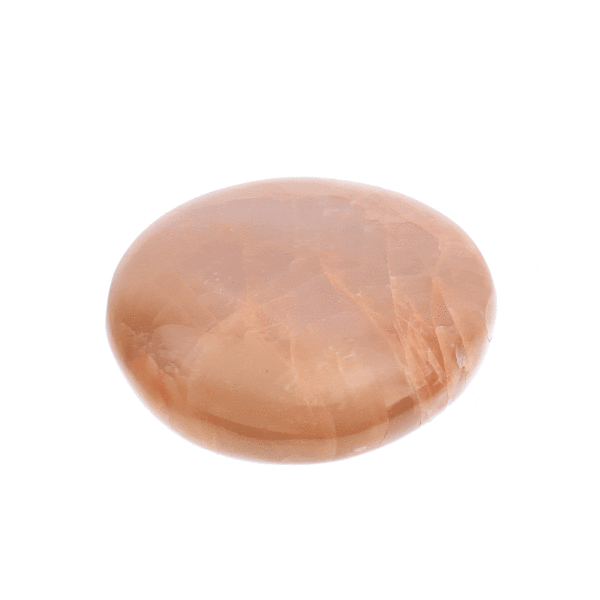 Polished 7cm pebble of natural peach-grey moonstone gemstone. 