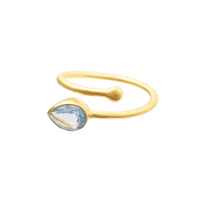 Handmade ring made of gold plated sterling silver and faceted, natural blue topaz gemstone in a drop shape. The size of the ring is adjustable. Buy online shop.