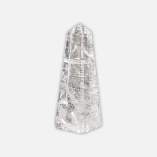 Obelisk made from natural crystal quartz gemstone, with a height of 10cm. Buy online shop.