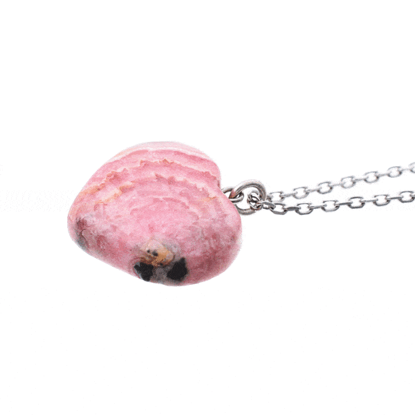 Pendant made from natural Rhodochrosite gemstone in heart shape. The pendant is worn on a handmade sterling silver chain. Buy online shop.