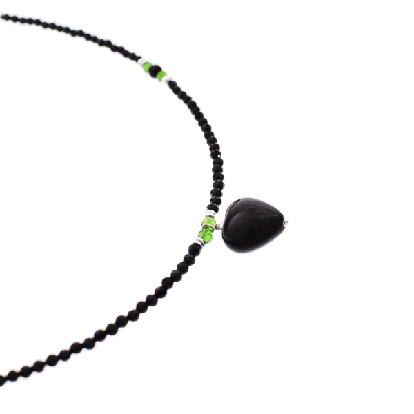 Handmade necklace with natural spherical shaped black spinel and dioptase gemstones and decorative sterling silver elements. In the middle of the necklace there is a natural black obsidian heart. Buy online shop.