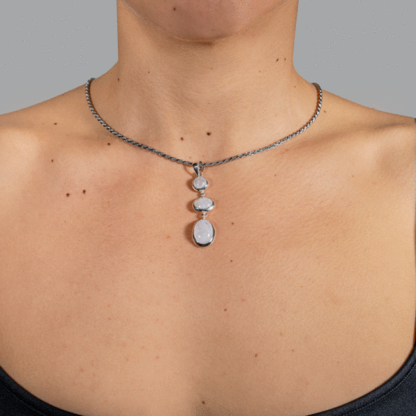 Handmade sterling silver pendant with natural oval and round shaped white labradorite  gemstones. The pendant is threaded on a sterling silver chain. Buy online shop.