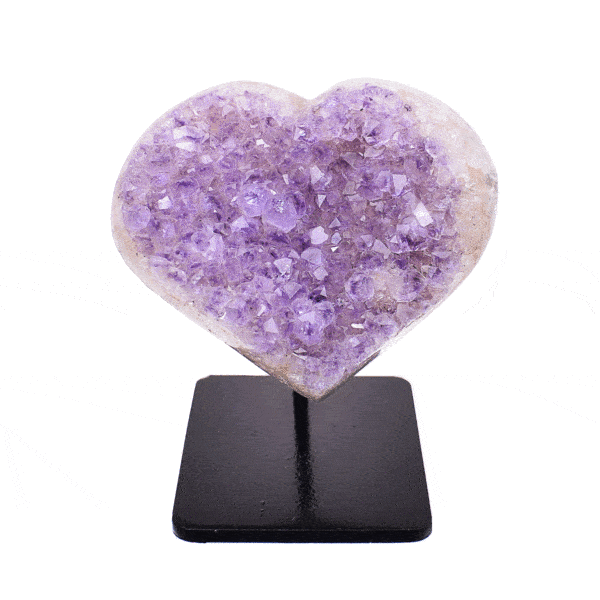 Heart made from natural amethyst gemstone with polished outline. The heart is embedded into a black, metallic base and the product has a height of 7.5cm. Buy online shop.
