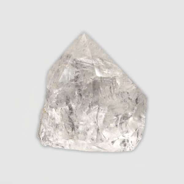 Point made from natural crystal quartz gemstone with polished top and a height of 7cm. Buy online shop.