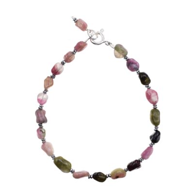 Handmade bracelet made of sterling silver and natural pebble shaped tourmaline gemstones. The bracelet is decorated with faceted hematite gemstone wheels. Buy online shop.