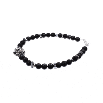 Handmade bracelet with natural black tourmaline and hematite gemstones with a silver lion in the center. The bracelet has a clasp and decorative elements made of sterling silver. Buy online shop.