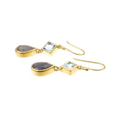 Handmade long earrings made of gold plated silver 925 and natural labradorite gemstones in oval shape and blue topaz in rhombus shape. Buy online shop.
