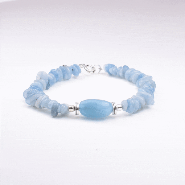 Handmade bracelet made of natural Aquamarine gemstone in an irregular and oval shape, with decorative sterling silver elements.