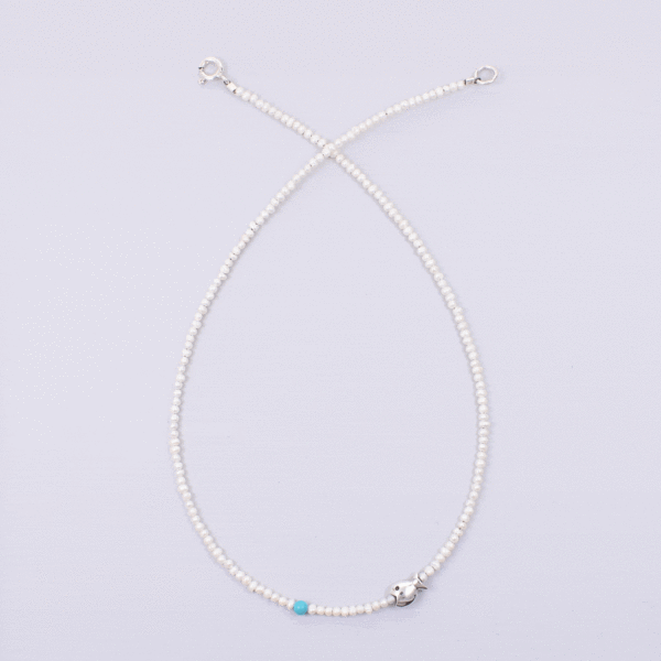 Handmade natural pearl necklace with spherical turquoise stone and a sterling silver fish.