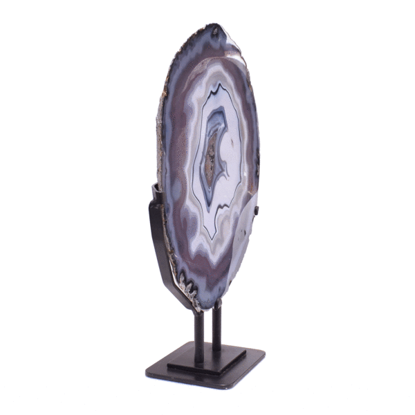 Polished slice of natural chalcedony gemstone with crystal quartz, placed on a black metallic base. The product has a height of 48cm. 