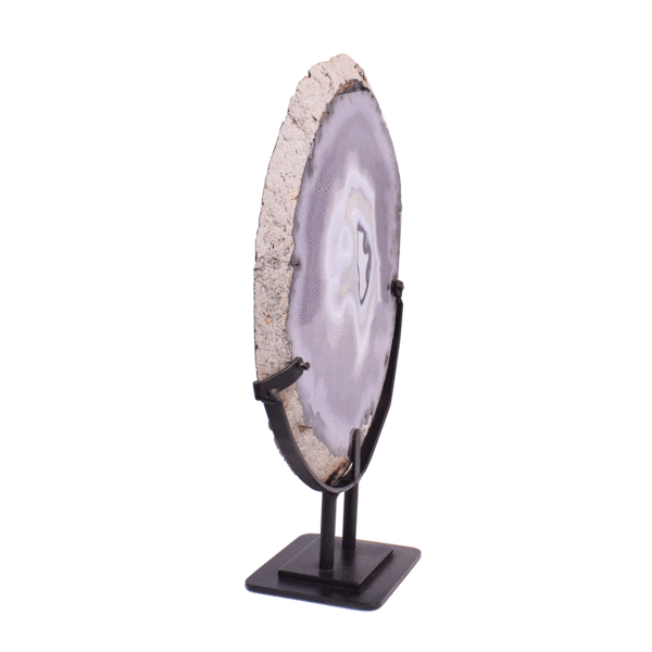 Polished slice of natural chalcedony gemstone with crystal quartz, placed on a black metallic base. The product has a height of 48cm. 