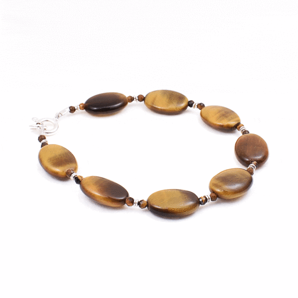 Handmade bracelet made of natural tiger's eye gemstones in an oval and spherical shape, with decorative sterling silver elements. Buy online shop.
