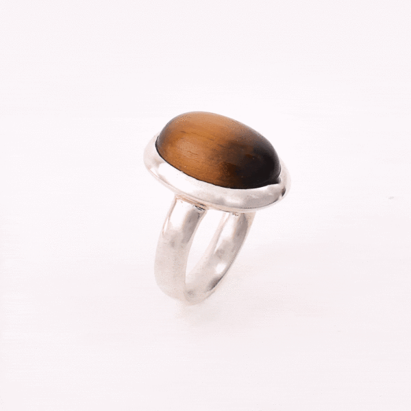 Handmade ring made of sterling silver and natural tiger's eye gemstone in an oval shape. Buy online shop.