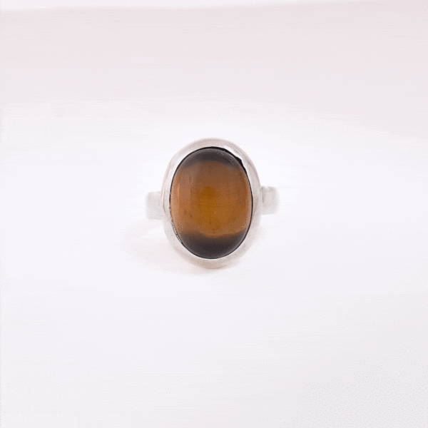 Handmade ring made of sterling silver and natural tiger's eye gemstone in an oval shape. Buy online shop.