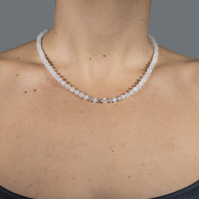Handmade necklace with natural, white, wheel and spherical shaped labradorite gemstones and decorative sterling silver elements.