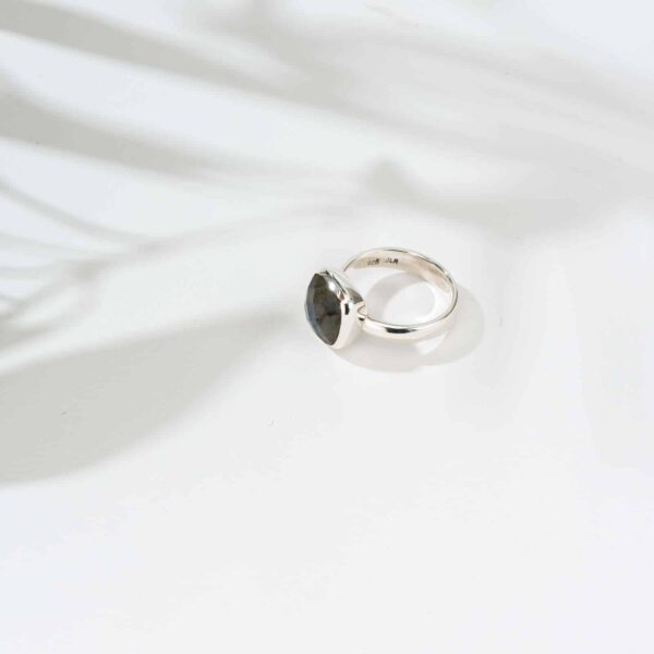 Ring made of sterling silver and natural, faceted, square shaped labradorite gemstone. 