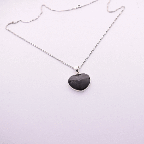 Handmade sterling silver necklace of natural, heart-shaped rainbow obsidian gemstone. 